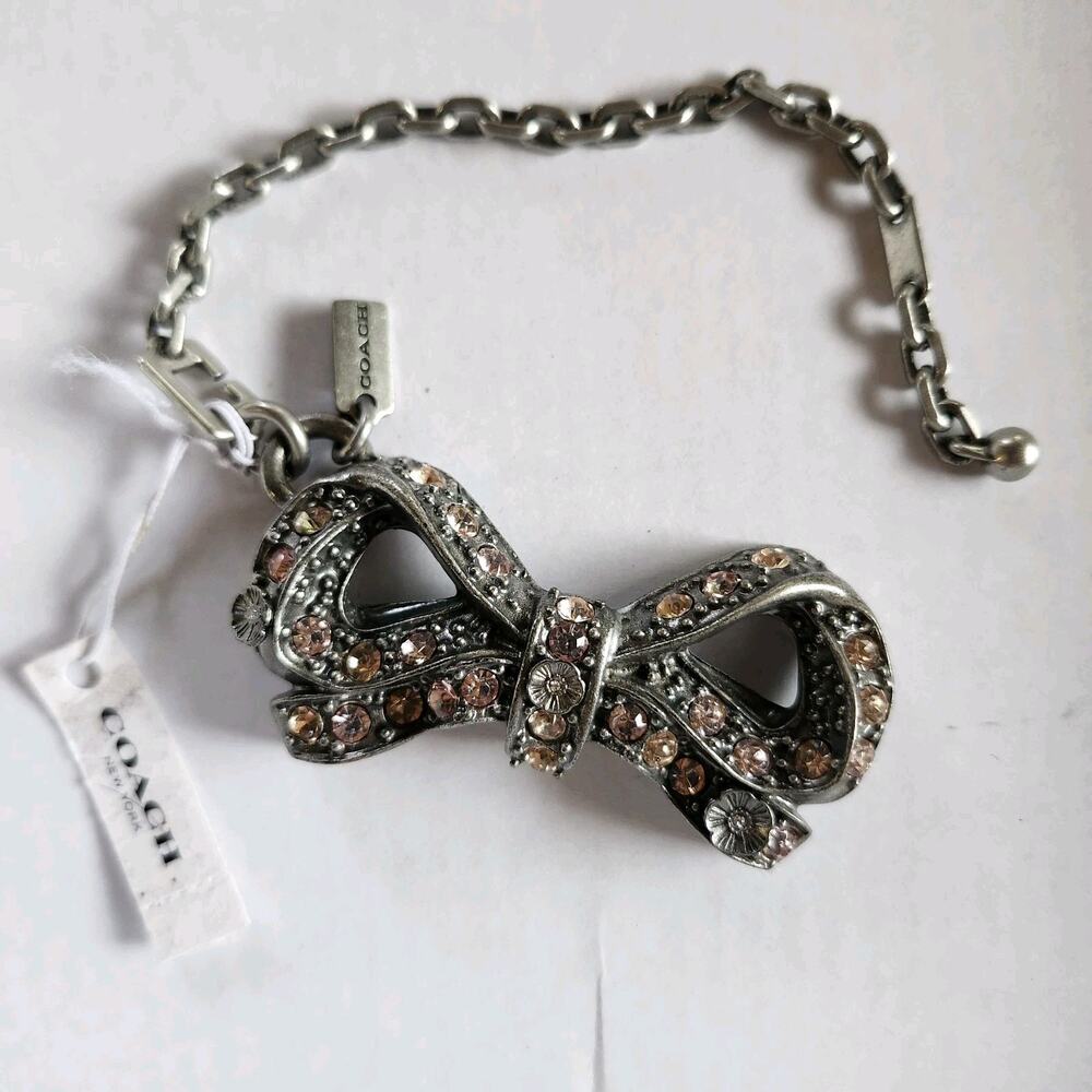 COACH x Selena Gomez Pavé Bow Bag Charm w/ Puzzle Chain, Rhinestones & Tea Roses